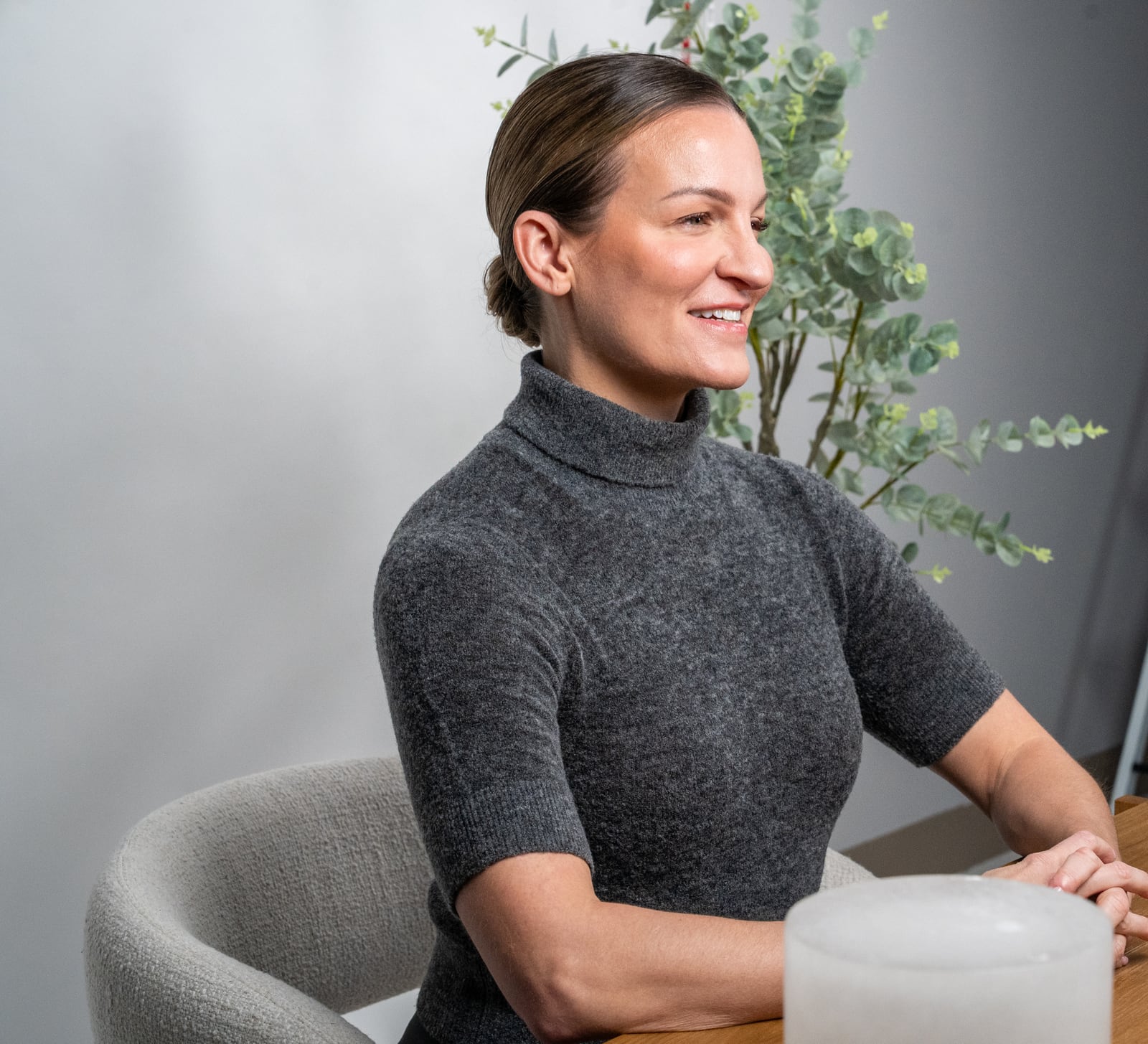 Dr. Marie Claire Bourque smiling at her screen during a virtual appointment